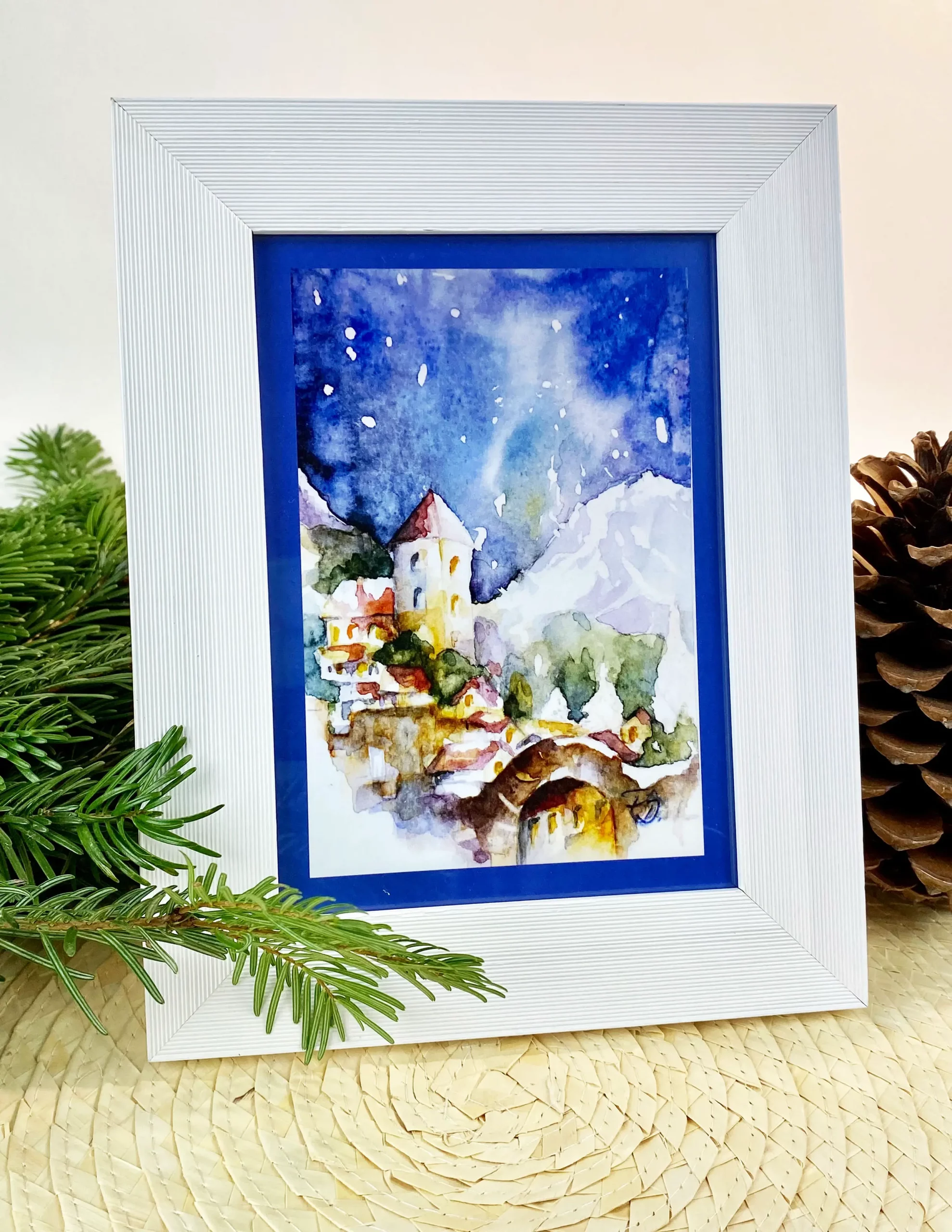 Weihnachtskarte Dorf im Schnee in weißem Rahmen