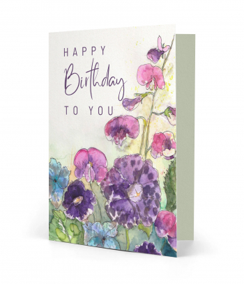 Vorderseite einer gedruckten Geburtstagskarte mit Spruch "Happy Birthday to you" auf bunten Blumen Aquarell-Motiv